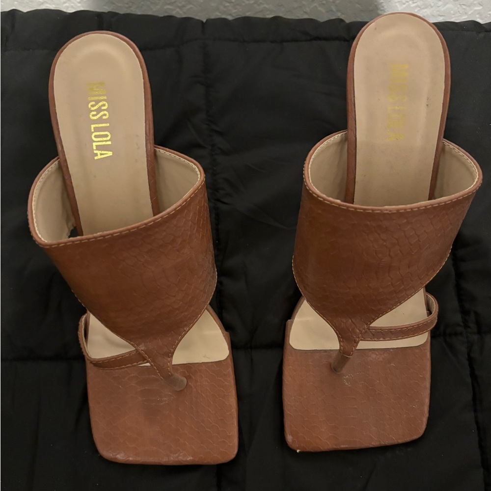 Size 7.5 tan heels. Only worn twice.